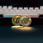 Golden Bitcoin coins in front of a keyboard, symbolizing digital currency and finance — Online Baccarat Lets You Experience R