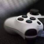 Close-up of a game controller on a textured surface